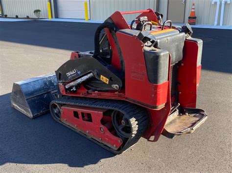 dingo skid|dingo stand on skid steer.